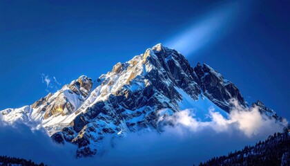 Majestic Mountain Peak: A breathtaking vista of a snow-capped mountain range, sculpted by nature's artistry against a deep blue sky, radiating strength.