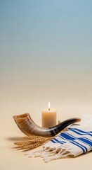 During Yom Kippur, a shofar and tallit rest beside a lit candle, symbolizing prayer and sacrifice on this sacred day of fasting and repentance for the Jewish community