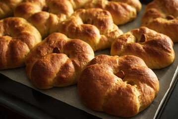 Freshly baked pumpkin-shaped sweet buns with almonds. Thanksgiving celebrating