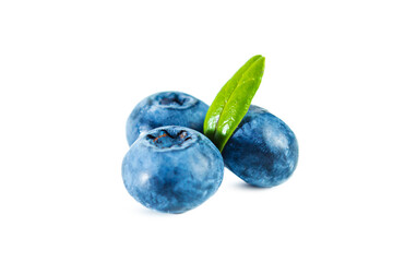 Ripe fresh blueberries with leaves isolated on white.