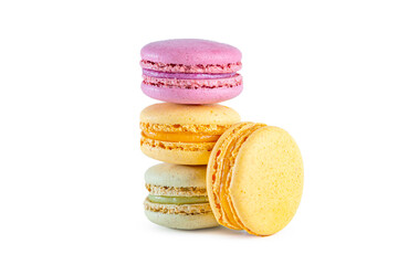 Stack of colorful French macarons isolated on white background.