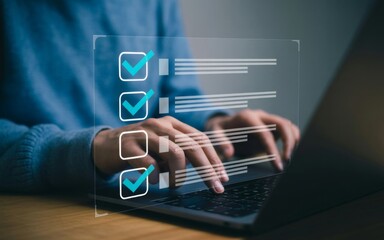 Digital Checklist: Hands on the keyboard completing an interactive checklist on laptop screen, symbolizing efficiency, completion, and goal-setting in a contemporary business setting.