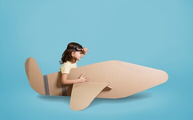 Cute little boy playing with toy airplane