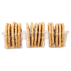 Three packs of thin crispy cookies in a transparent container