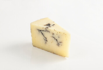 Wedge of truffle cheese isolated on white background gourmet food