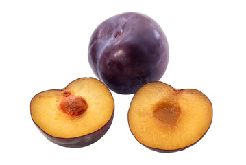 Whole plum and plum cut in half with view of pit isolated