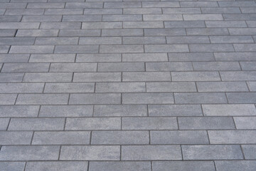 Grey pavement block texture creating an urban floor pattern