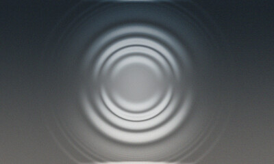 Concentric ripples emanating from a central point on a metallic surface, creating a mesmerizing visual effect.