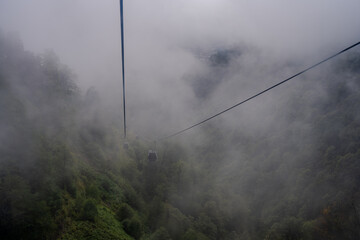 Cable cars in dense fog Qabala Azerbaijan