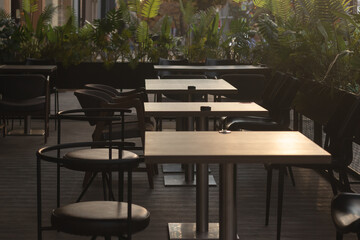 Wooden tables and chairs at an outdoor cafe in Rostov-on-Don, Russia