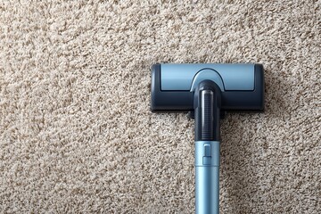 A modern blue and grey vacuum cleaner head cleaning a soft, beige shaggy carpet, symbolizing household chores and cleanliness.