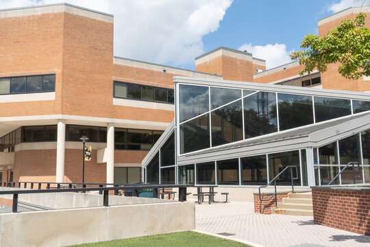 Baltimore, Maryland US - August 29, 2025: cement and brick paver patio outside of Hawkins Hall on the campus of Towson University