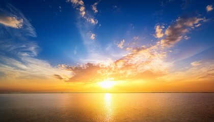 Obraz premium Colorful Sunrise Gold And Blue Sky Background