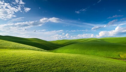 Obraz premium Green Grass Field On Small Hills And Blue Sky With Clouds Summer Spring Landscape Background Generative Ai
