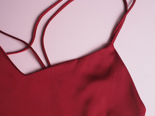 Close-up of a women's burgundy peignoir. Clothes, women's underwear, texture.