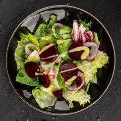 Beet salad green leaf lettuce vegetables natural product tasty snack fresh delicious gourmet food background on the table rustic top view copy space keto and paleo diet vegan and vegan food