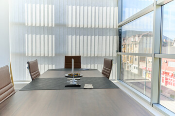 Modern Office Interior with Wooden Furniture, Conference Table, and Computers