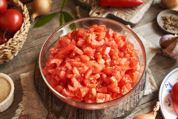 Chopped peeled tomatoes and spices - preparation of homemade relish (ajvar-style vegetable spread, chutney or bruschetta topping)