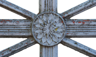 Weathered ornamental metal detail with floral pattern
