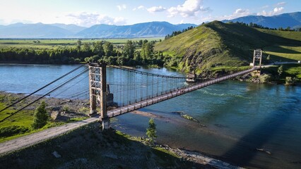 Suspension bridge over Katun River near Multa village, Altai, Russia
