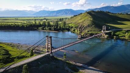 Suspension bridge over Katun River near Multa village, Altai, Russia