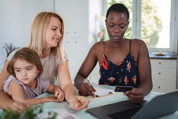 Family receiving financial advice from consultant at home
