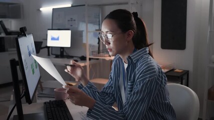 Glasses, serious and business woman at night on a computer or working late tired with deadline in an office. Research, email and overtime or corporate worker or analysis and on pc - Powered by Adobe