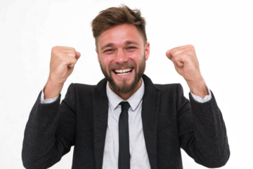 A joyful bearded man in a suit clenches his fists in a gesture of success and excitement, smiling broadly at the camera against a white background.