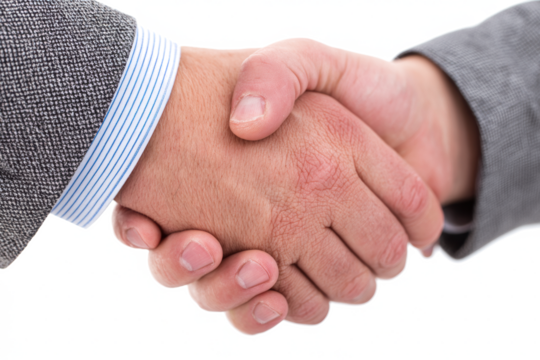 Close-up of a firm handshake between two businesspeople in formal suits, symbolizing an agreement or partnership.