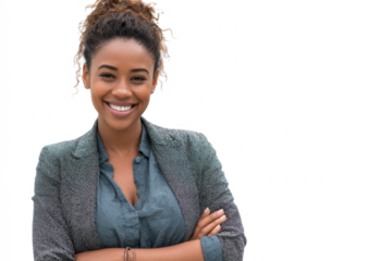 Smiling woman in business attire with arms crossed against a white background.