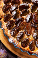 German plum cake with cinnamon, served with ice cream and coffee.