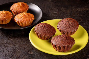 Delicious chocolate and lemon muffins ready to indulge on plates