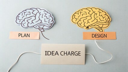 Two Paper Brain Outlines Linked by Lightning Illustrating Idea Charge