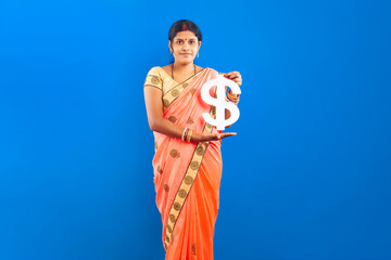 Indian Woman in Traditional Saree Holding Dollar Sign for Financial Concept