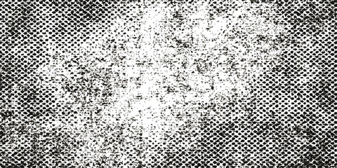 A seamless black and white metal mesh pattern with a grunge texture backdrop