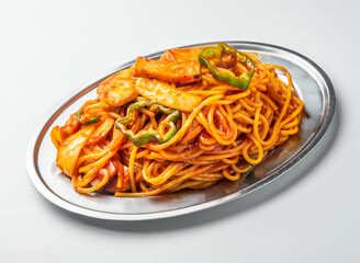 Classic Japanese Naporitan Spaghetti with Ketchup Sauce, Sausage, and Bell Peppers on white background side view