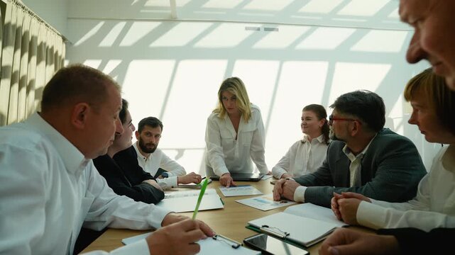 Businesswoman leading corporate meeting and brainstorming session