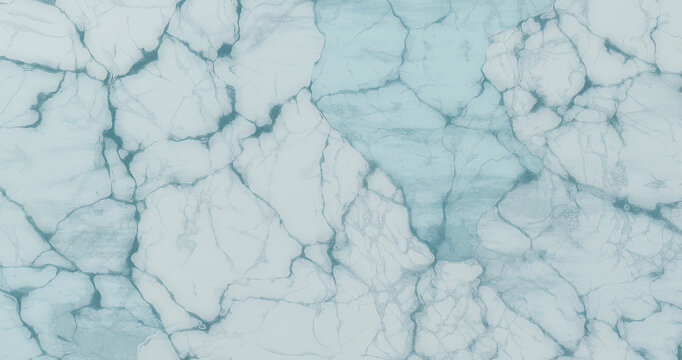 Aerial view of cracked sea ice in the arctic ocean, showcasing the intricate patterns and textures formed by the frozen water, creating a mesmerizing natural landscape