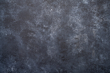 Dark concrete surface providing a rough urban textured background
