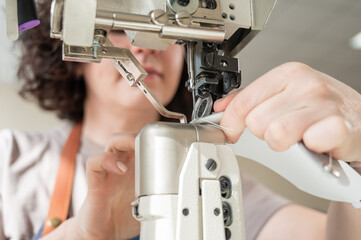 Woman tanner at work in the workshop. 