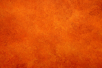 Orange textured wall surface showing grunge pattern and rough rustic details