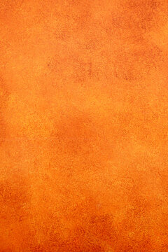 Orange background presenting a grunge texture with color gradient