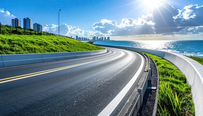A scenic coastal highway curves gently alongside a verdant hillside, offering a captivating view of a distant cityscape under a bright, sunlit sky