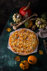 Halloween scary pizza in shape of pumpkin
