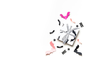 Halloween gift boxes with spiderweb design and paper bats.