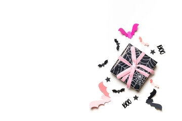 Halloween gift boxes with spiderweb design and paper bats.