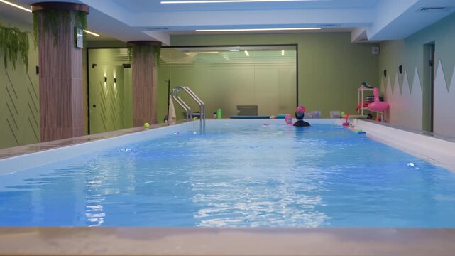 Stunning view of swimming pool environment, clear water with blue ripples, sunlit deck, clean tiles, bright reflections, palm shadows, loungers nearby, tranquil resort vibe, minimal architecture