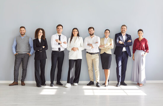 Diverse HR interviewers, happy smiling office people standing in row, waiting for meeting, potential employers hiring, supervising, group, corporate company staff team welcoming, professional teamwork