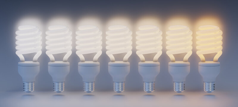 Array of Compact fluorescent light bulbs - CFL - Energy saving bulbs. From left to right starting with cold white and ending with a warm white