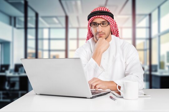 A saudi character man sitting working in office